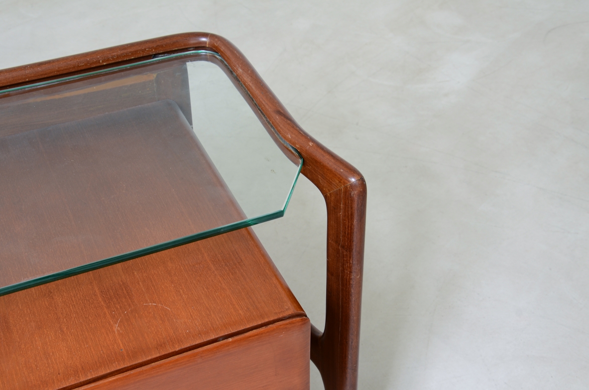 curved wooden console with double row of light wood drawers 1960's manufacturing.