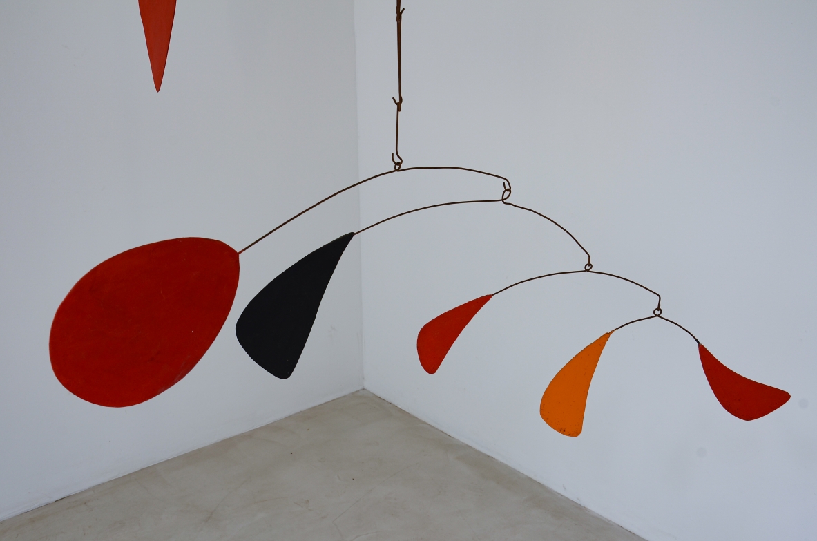 Splendid large kinetic sculpture made up of 15 iron and painted plastic board scales.