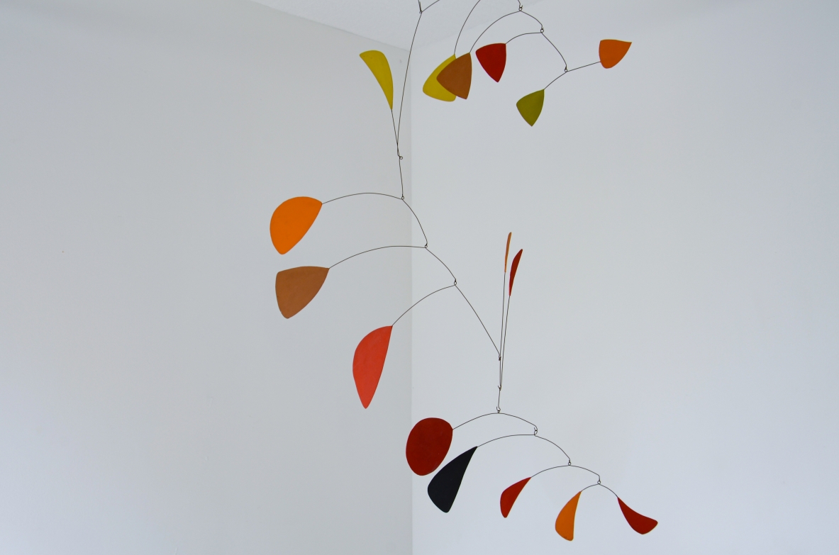 Splendid large kinetic sculpture made up of 15 iron and painted plastic board scales.