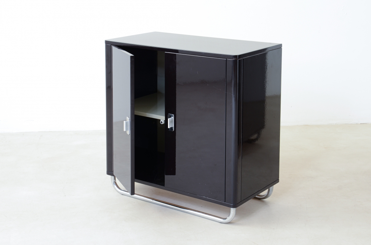 Pair of small storage units in lacquered wood with chromed tubular base . Bauhaus,1930
