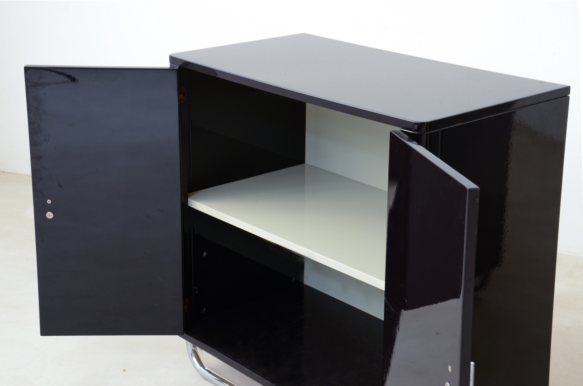 Pair of small storage units in lacquered wood with chromed tubular base . Bauhaus,1930