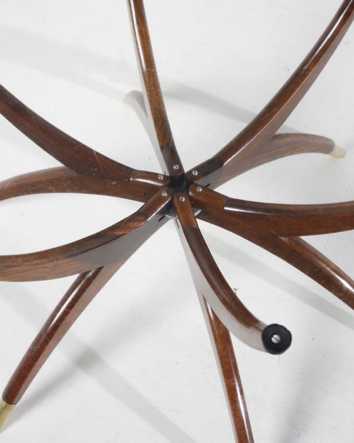 Elegant low table with 6 legs in curved wood with brass tips and cut glass top '50