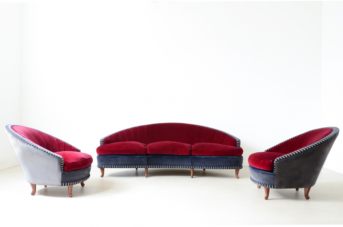 Living room composed of an elegant curved sofa and two armchairs ca. 1940.