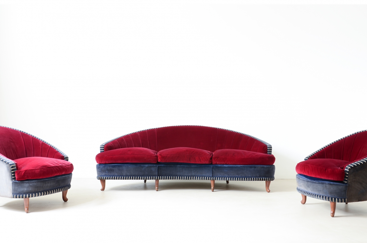 Living room composed of an elegant curved sofa and two armchairs ca. 1940.