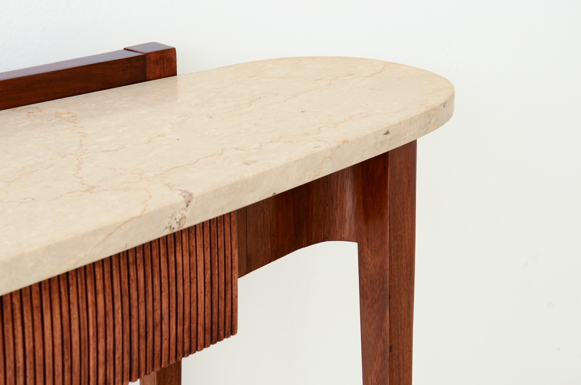 Elegant console moved on the front and sides, drawers and oval travertine top,