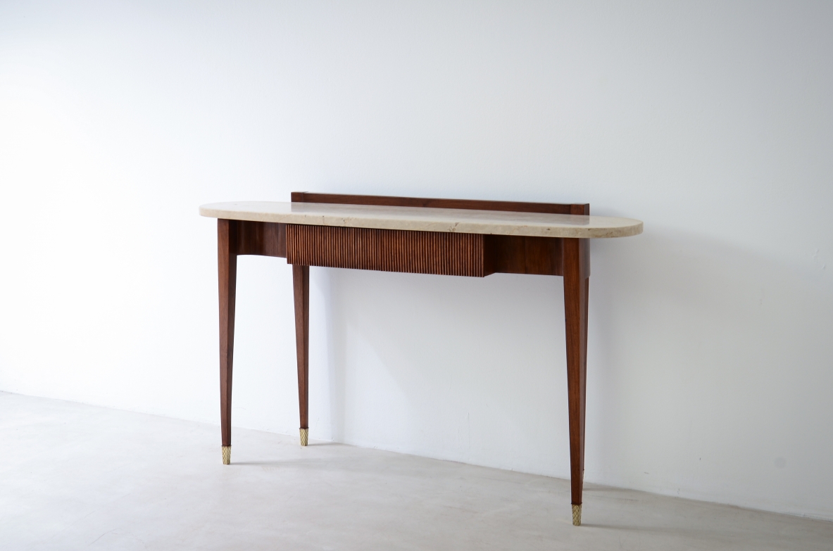 Elegant console moved on the front and sides, drawers and oval travertine top,