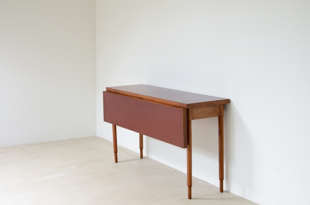 Walnut console/ dining table with red lacquered top. 1960's