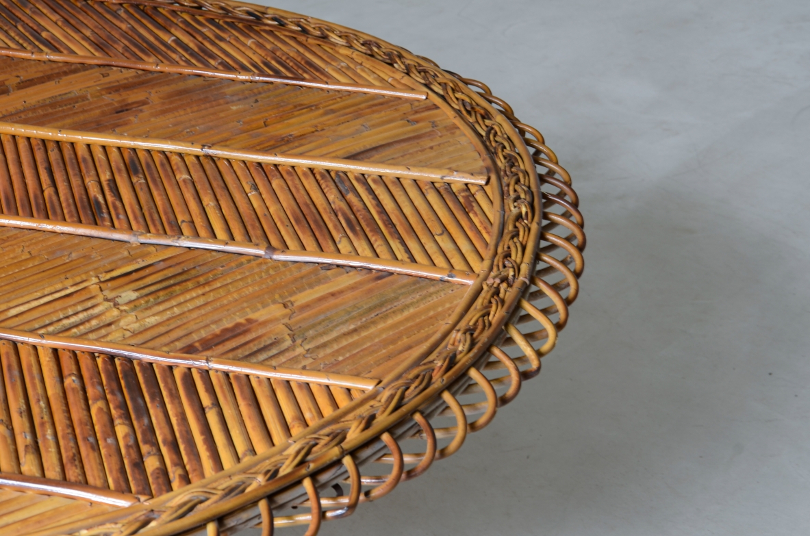 Large low table with herringbone rattan top and curved iron leg. 60's