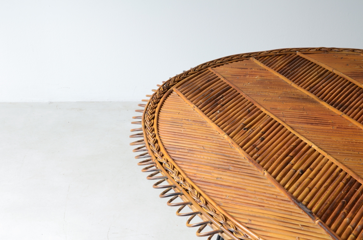 Large low table with herringbone rattan top and curved iron leg. 60's
