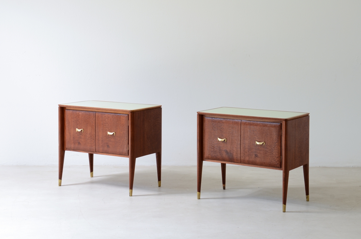 Pair of bedside tables with tapered legs, brass tips and handles 1950's
