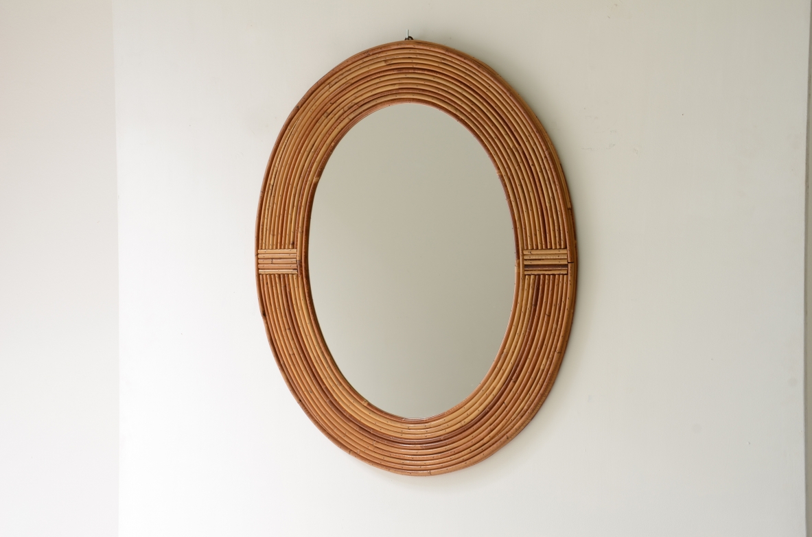 Vivai del Sud  Oval shaped tropical rattan mirror.