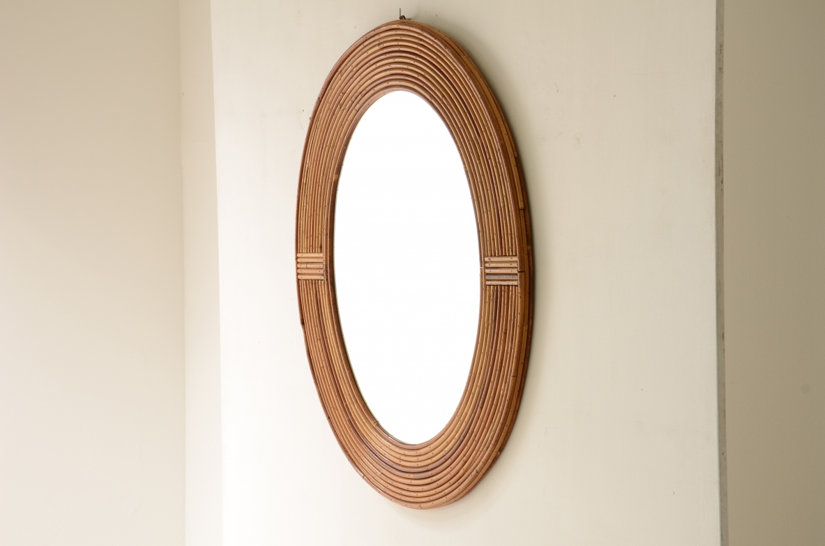 Vivai del Sud  Oval shaped tropical rattan mirror.