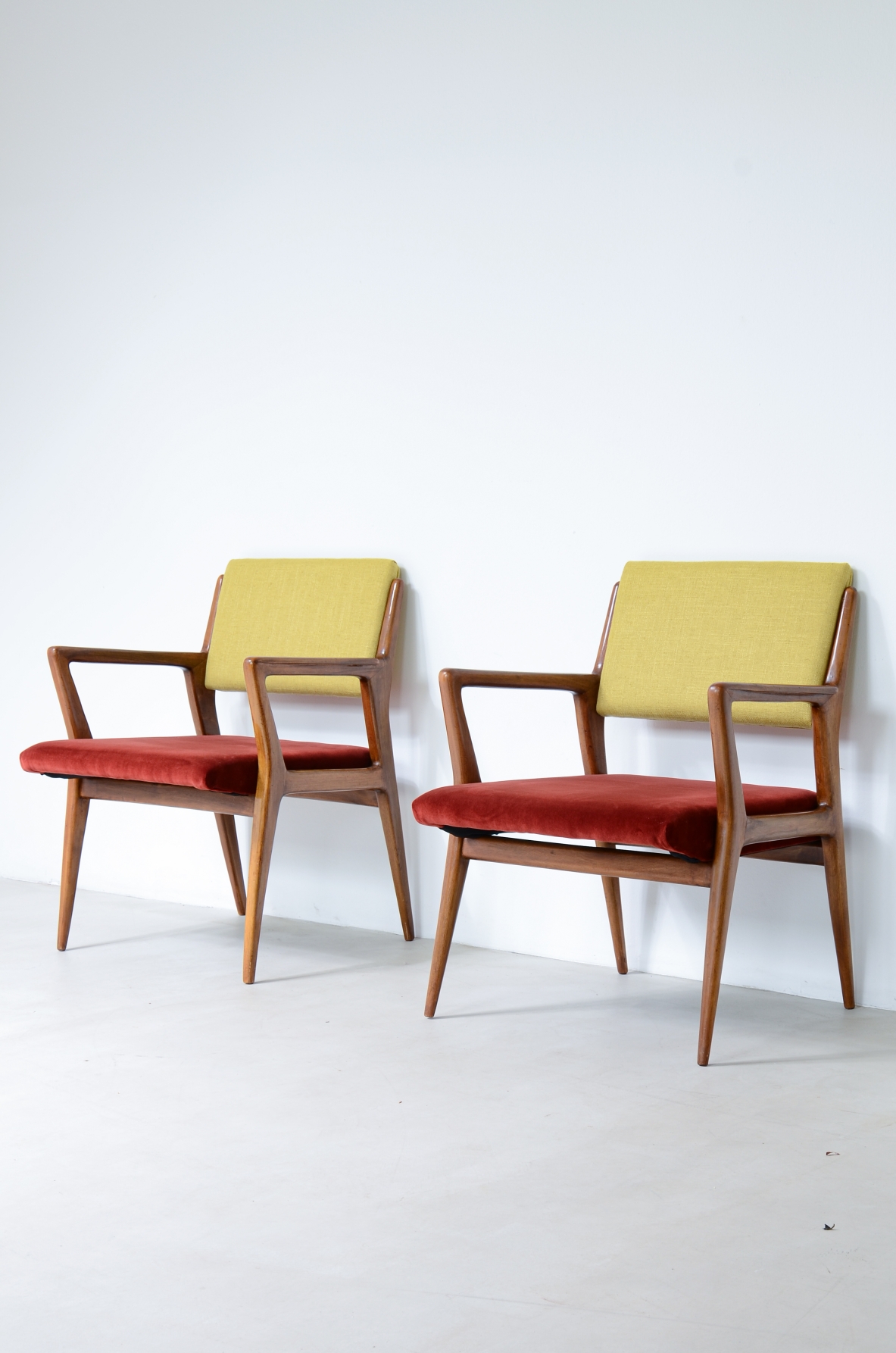 Pair of modernist walnut armchairs.  Italian manufacture 1950