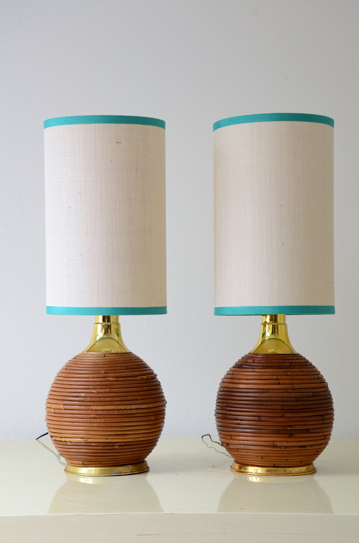 Pair of lamps in the style of Gabriella Crespi in rattan and turned brass 1970