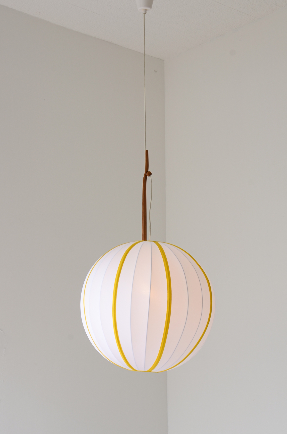 Hans Agne Jacobsson  Large chandelier in striped fabric and shaped teak rod. Manufacture Sweden ca. 1960's