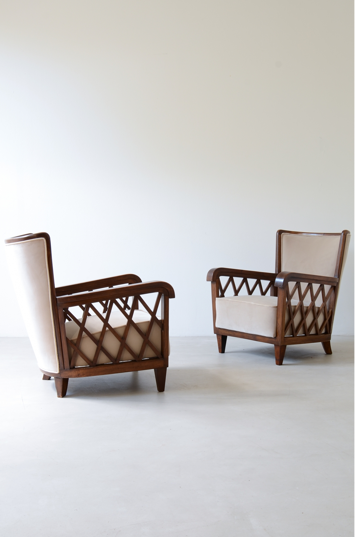 Maurizio Tempestini  Pair of armchairs in shaped wood and padded fabric.  Italian manufacture, Florence 1955ca.