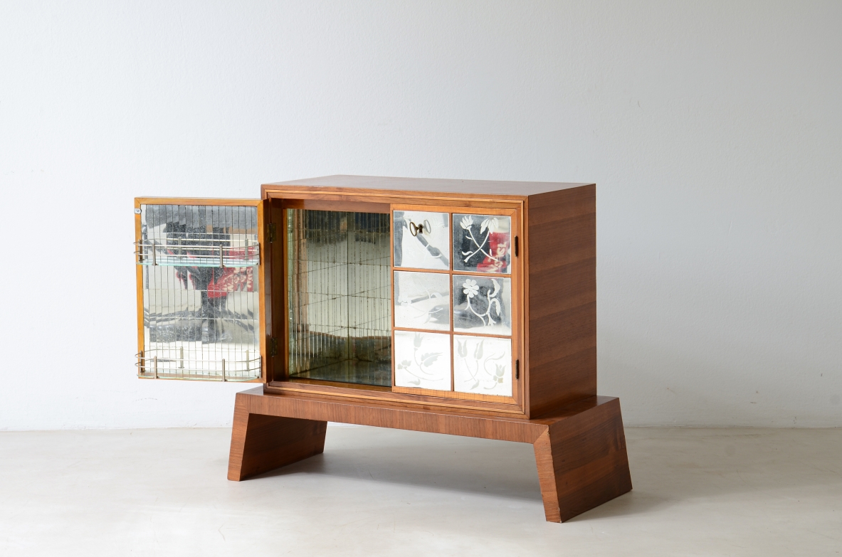 Small wooden bar cabinet with engraved and ground mirror.