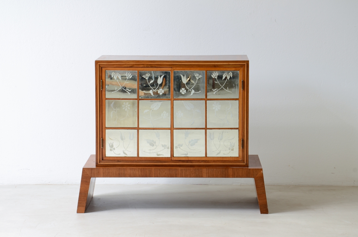 Small wooden bar cabinet with engraved and ground mirror.
