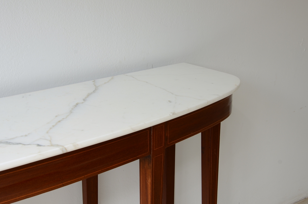 Elegant console with eight tapered legs and Carrara marble top.  Italian manufacture, ca.1950s.