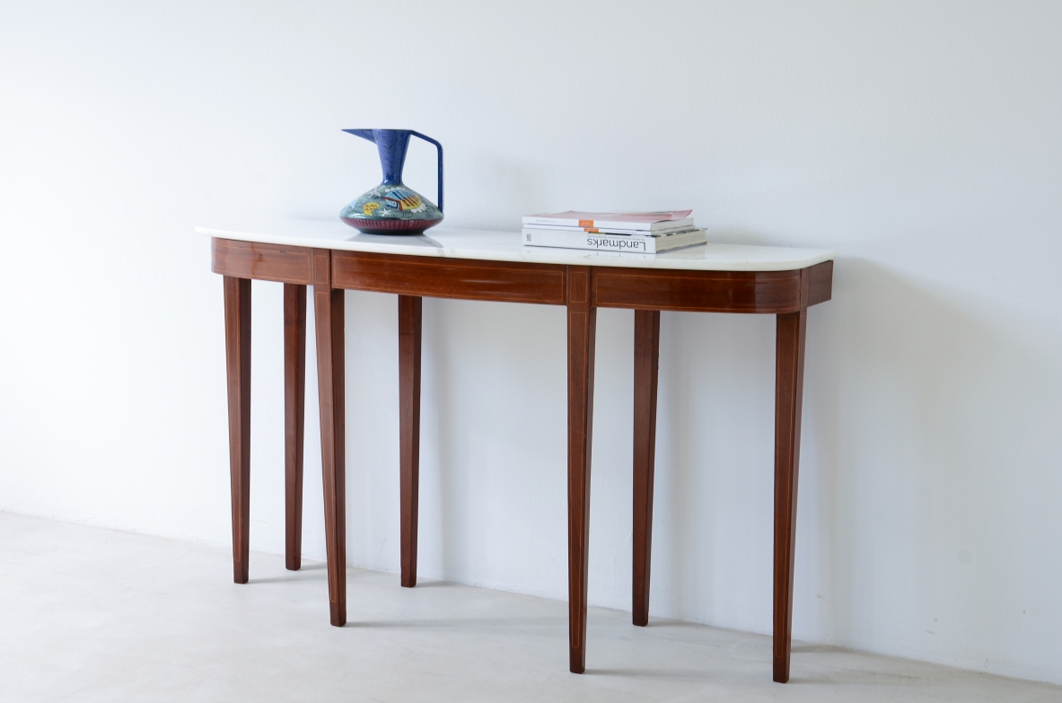 Elegant console with eight tapered legs and Carrara marble top.  Italian manufacture, ca.1950s.