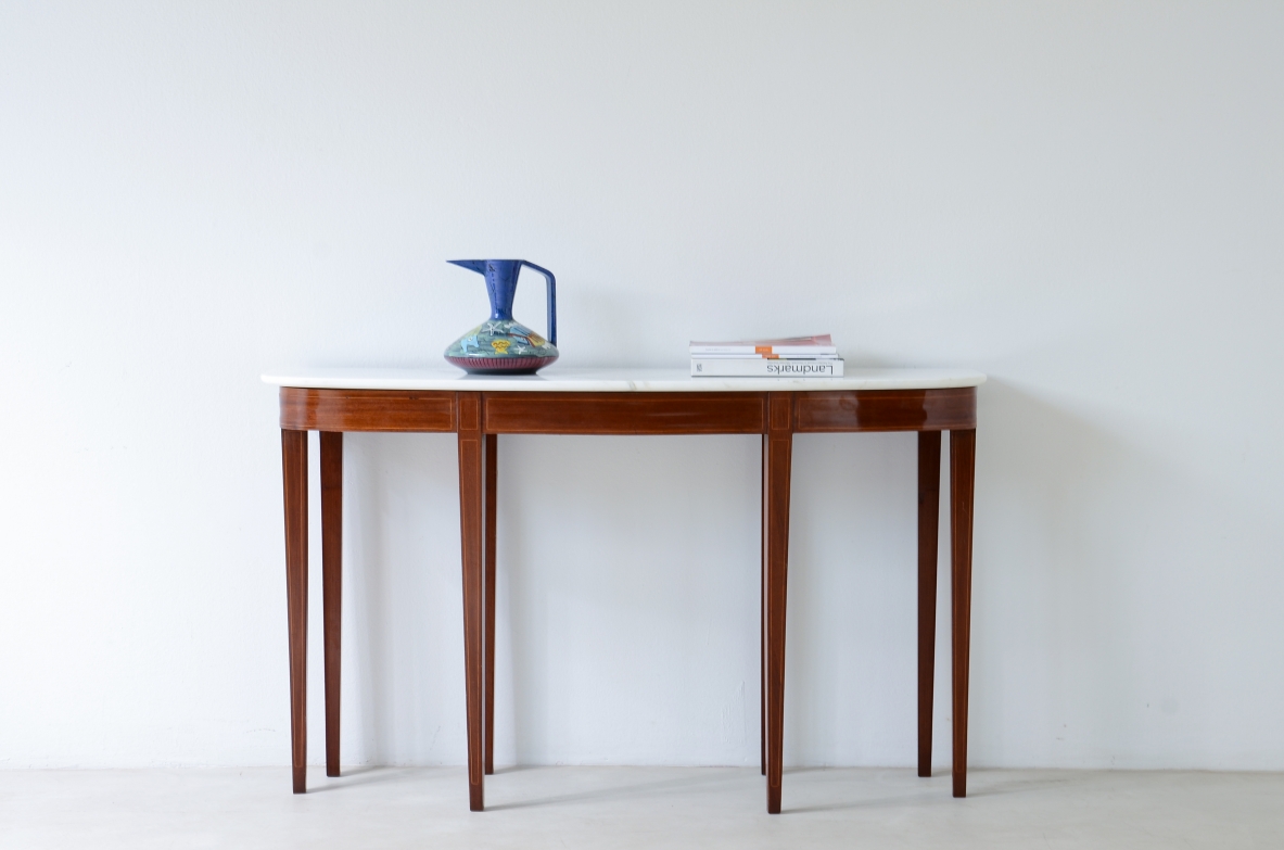 Elegant console with eight tapered legs and Carrara marble top.  Italian manufacture, ca.1950s.