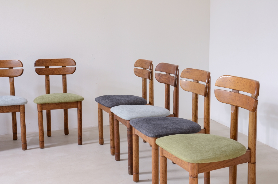 Set of 10 1960s oak chairs with shaped backrest and padded fabric seat.