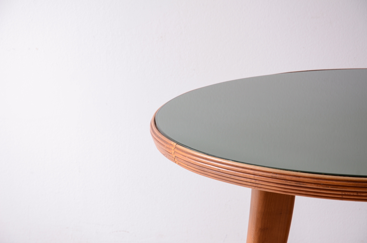 Elegant walnut table with sabre legs, striped band and cut glass top.  Italian manufacture from the 1940s.