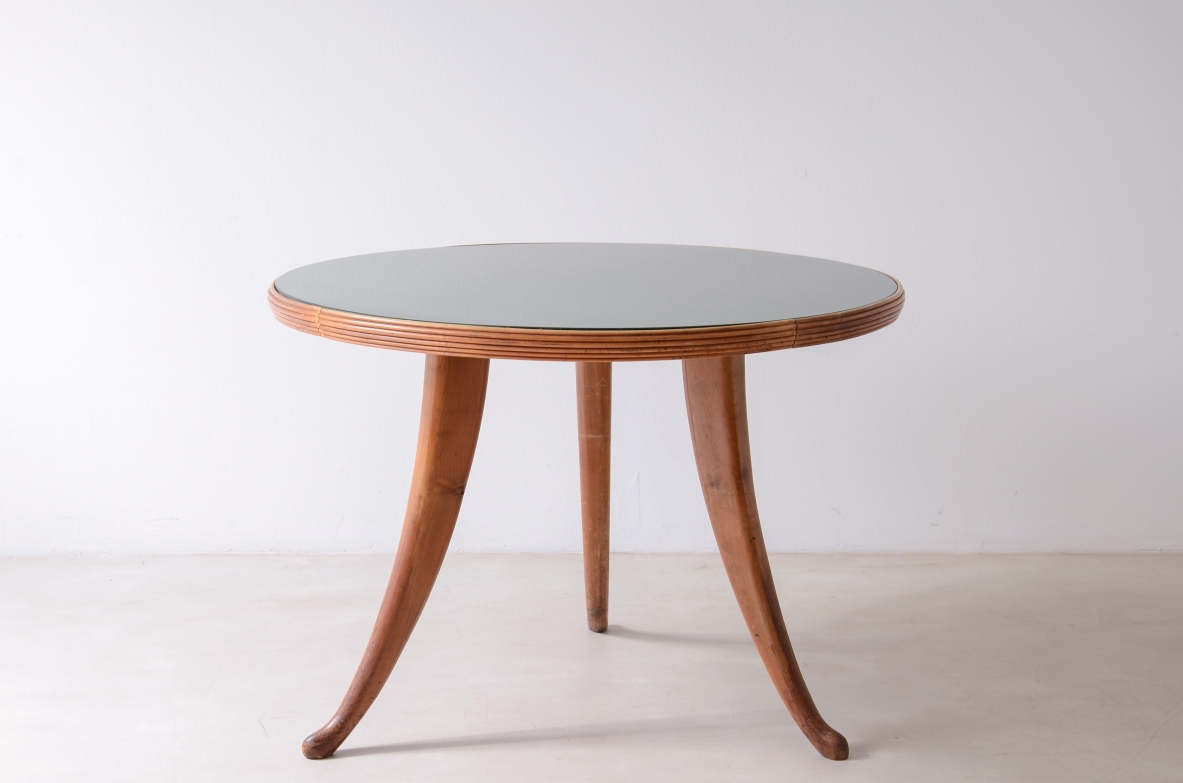 Elegant walnut table with sabre legs, striped band and cut glass top.  Italian manufacture from the 1940s.