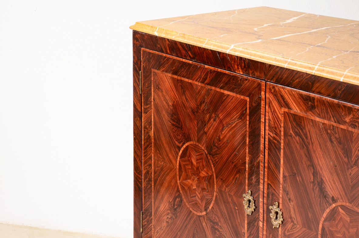 Splendid neoclassical two-door cabinet in veneered wood and inlaid with geometric motifs.Neapolitan cabinetmaking, ca. 1770.