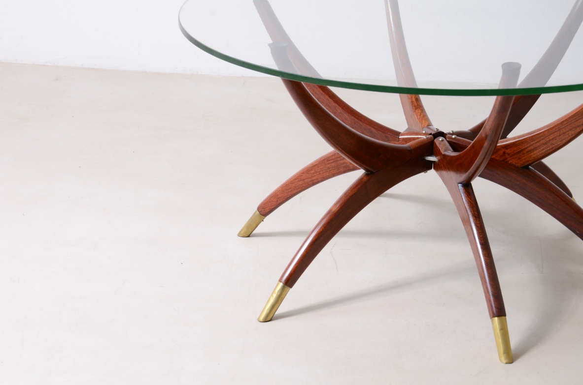 Elegant low table with 6 legs in curved wood with brass tips and cut glass top '50