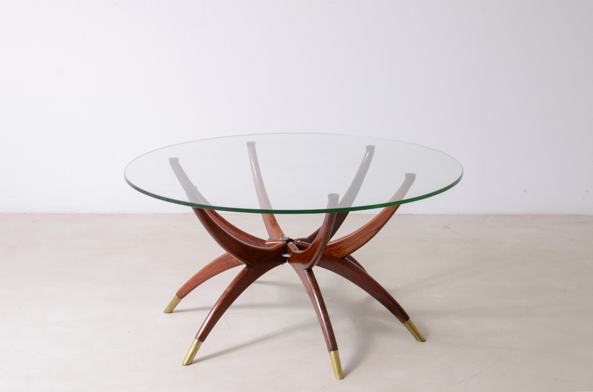 Elegant low table with 6 legs in curved wood with brass tips and cut glass top '50