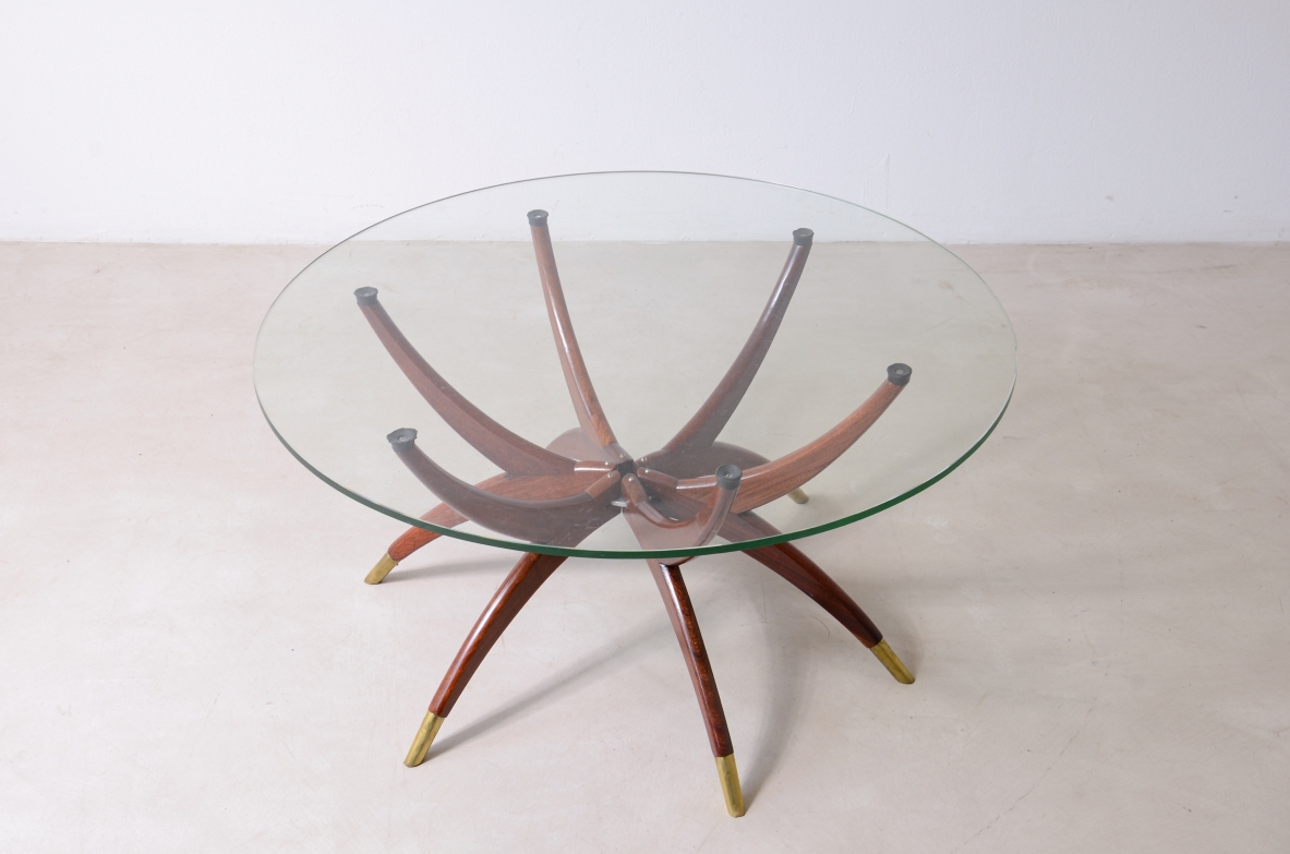 Elegant low table with 6 legs in curved wood with brass tips and cut glass top '50