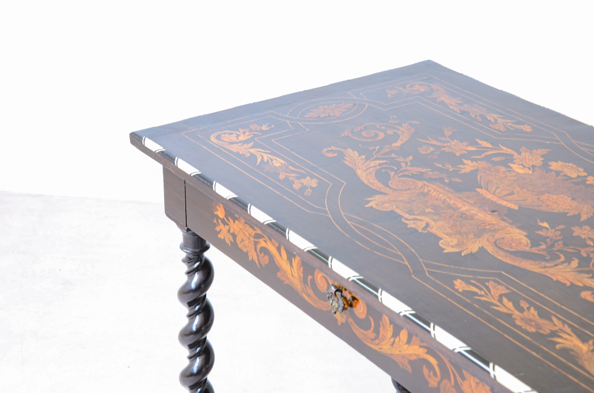 table finely inlaid in various woods and profiled in ivory 1850