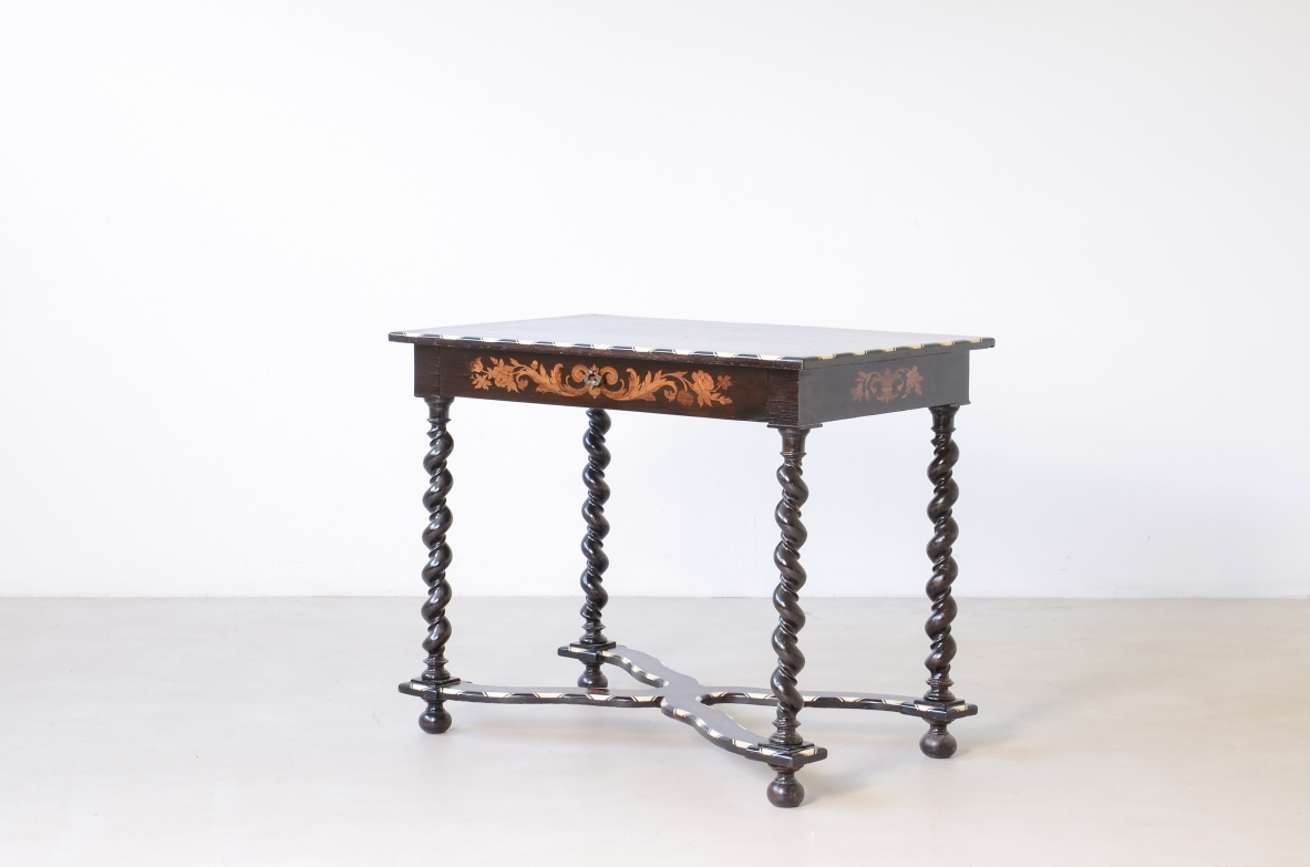 table finely inlaid in various woods and profiled in ivory 1850
