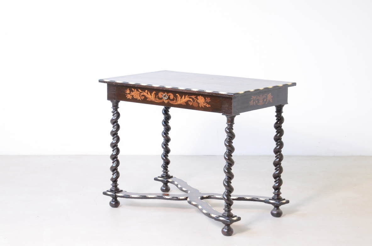 table finely inlaid in various woods and profiled in ivory 1850