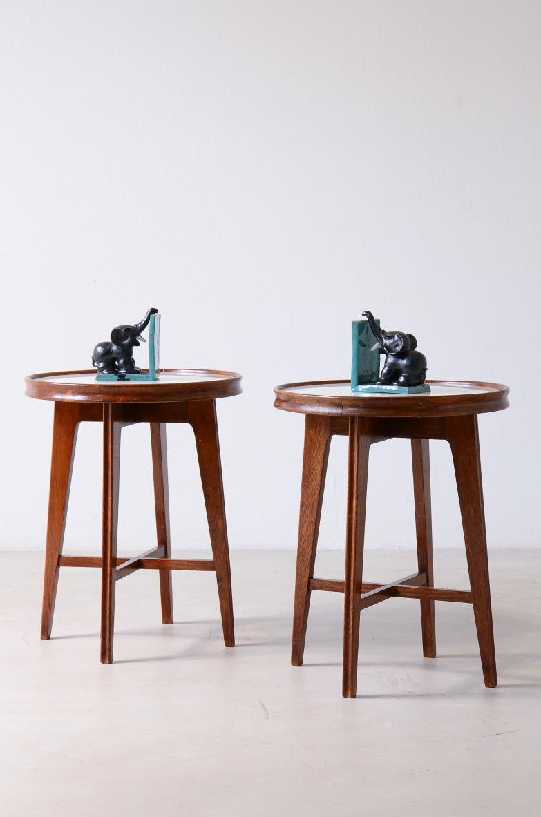 Pair of 1940's oak coffee tables with four tapered legs and a crosspiece at the base.