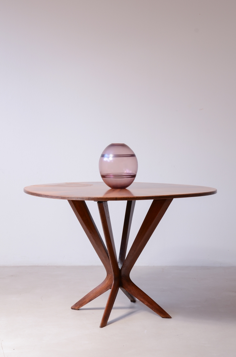 Table with an elegant central leg and a walnut top .Italian manufacture, circa 1950.
