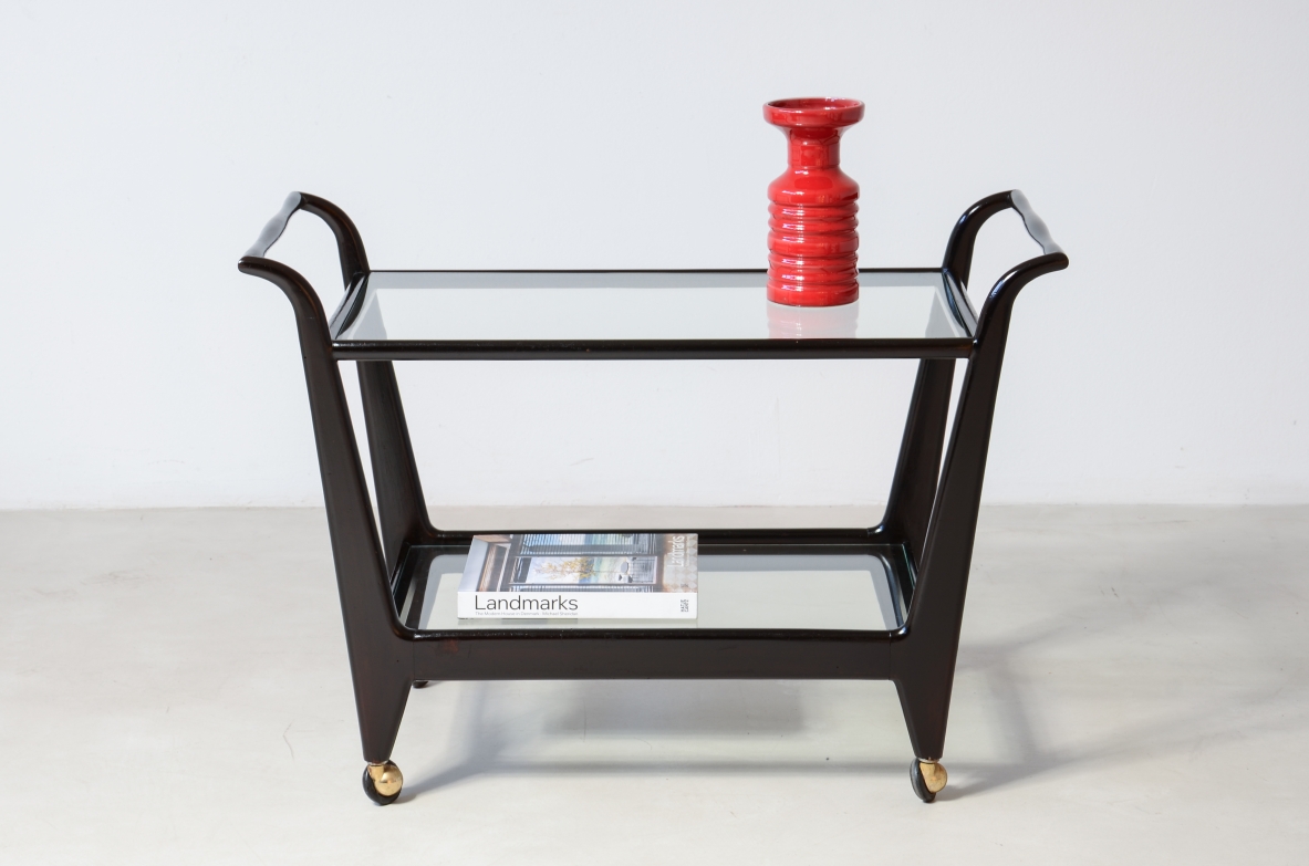Stained wood serving trolley with two cut glass shelves.  Italian manufacture, ca. 1950.
