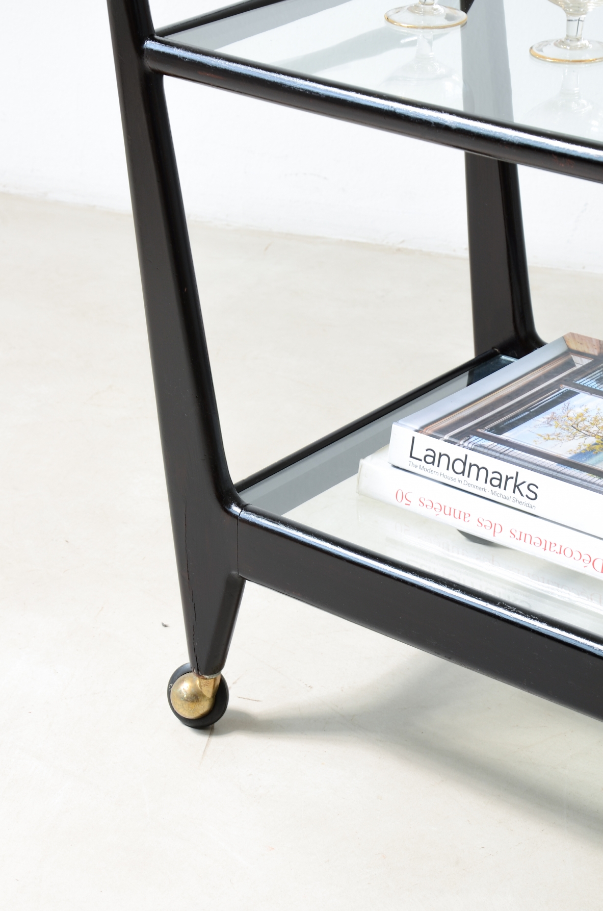 Stained wood serving trolley with two cut glass shelves.  Italian manufacture, ca. 1950.