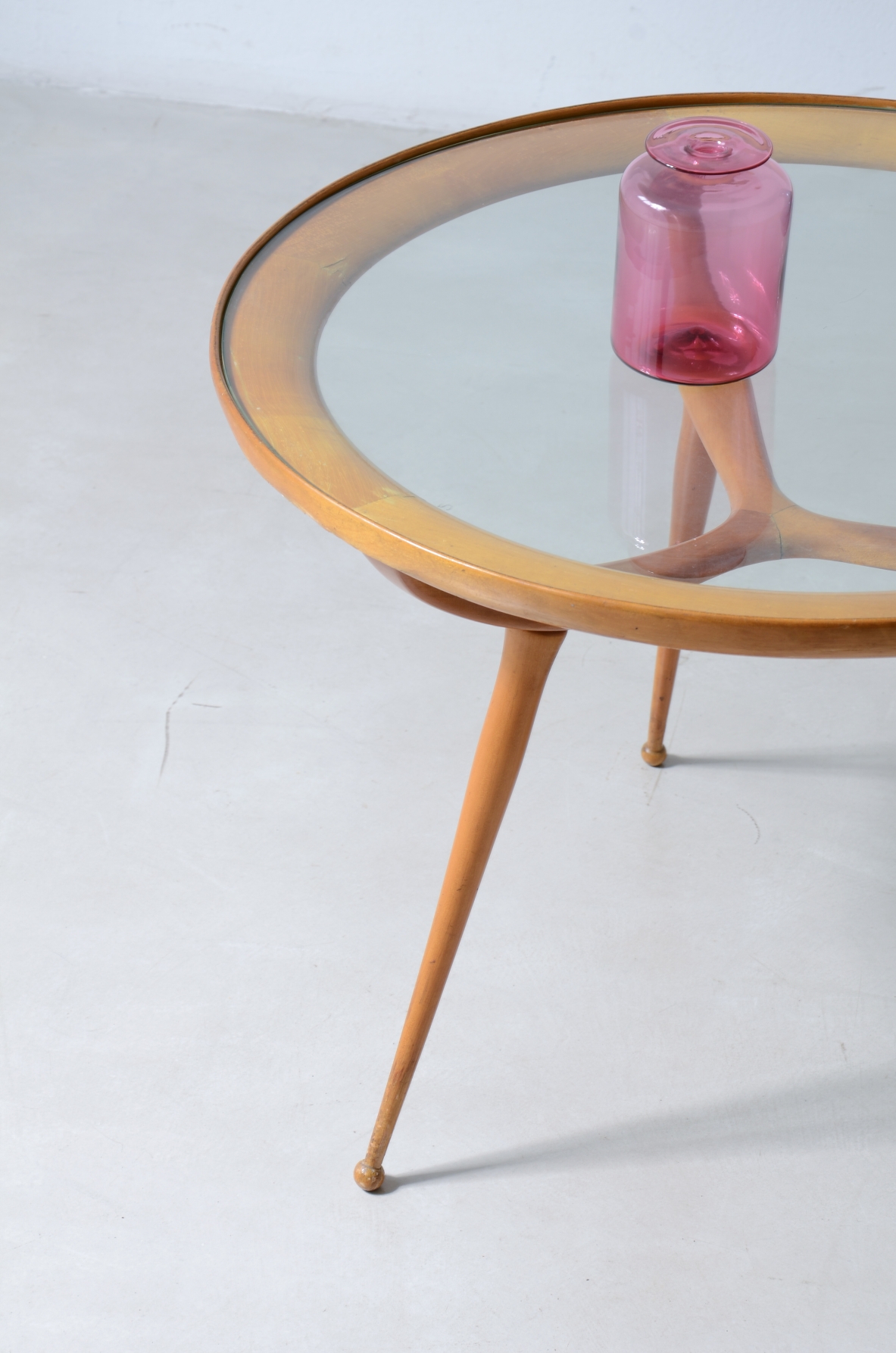 1950'S Cherrywood coffee table with a circular cut glass top.