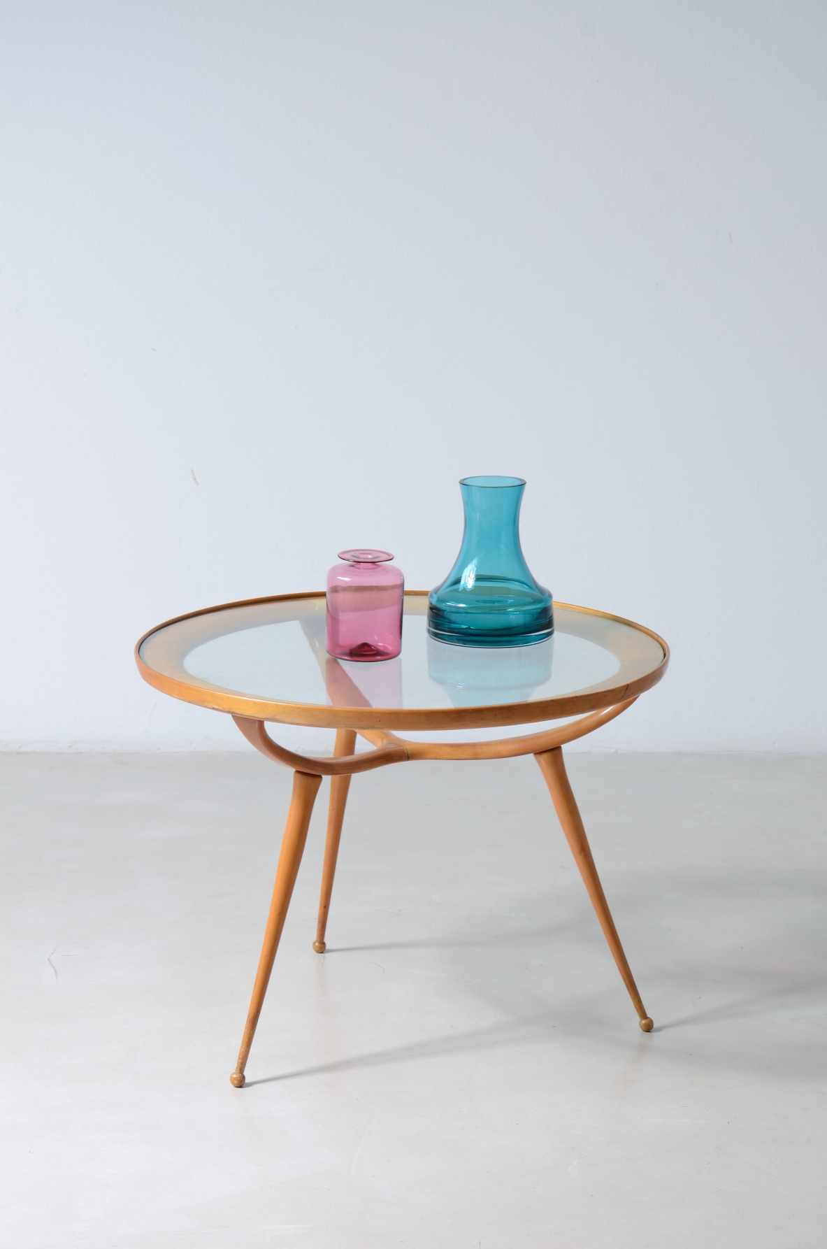 1950'S Cherrywood coffee table with a circular cut glass top.