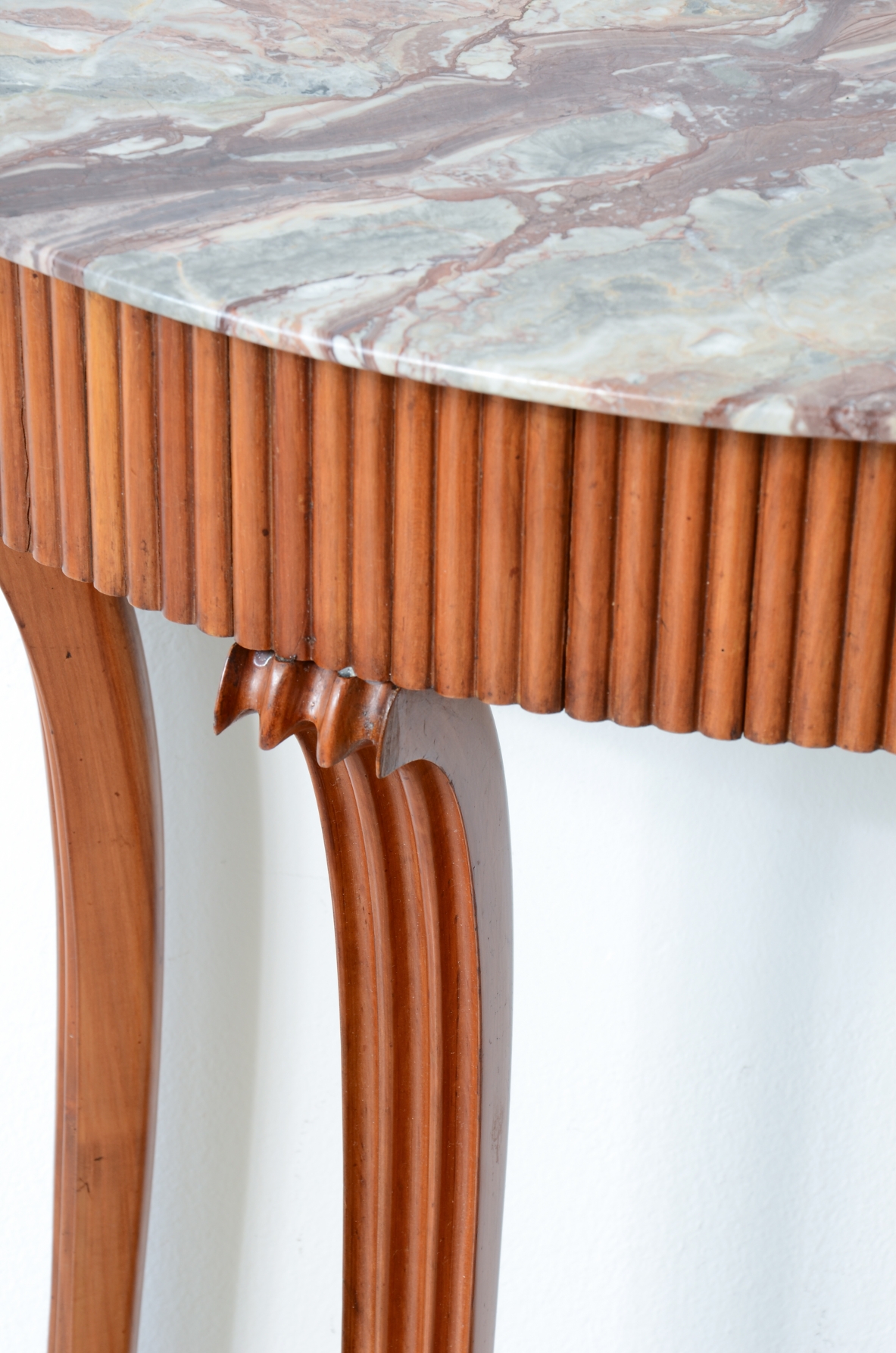 Elegant console table with a reeded wood band. Attr: Paolo Buffa, Italian manufacture, ca. 1940.