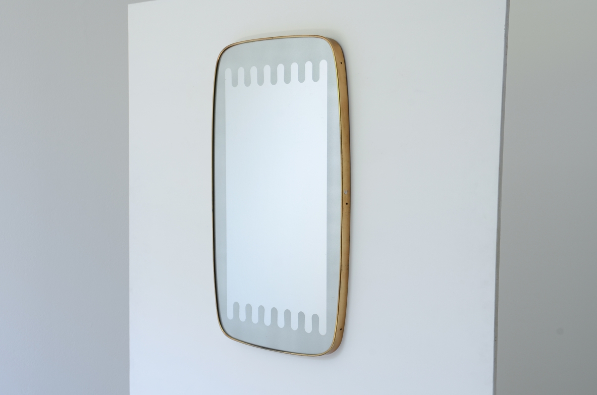 Pietro Chiesa  Elegant shaped mirror with a refined satin wave finish. Fontana Arte manufacture, ca.1950.