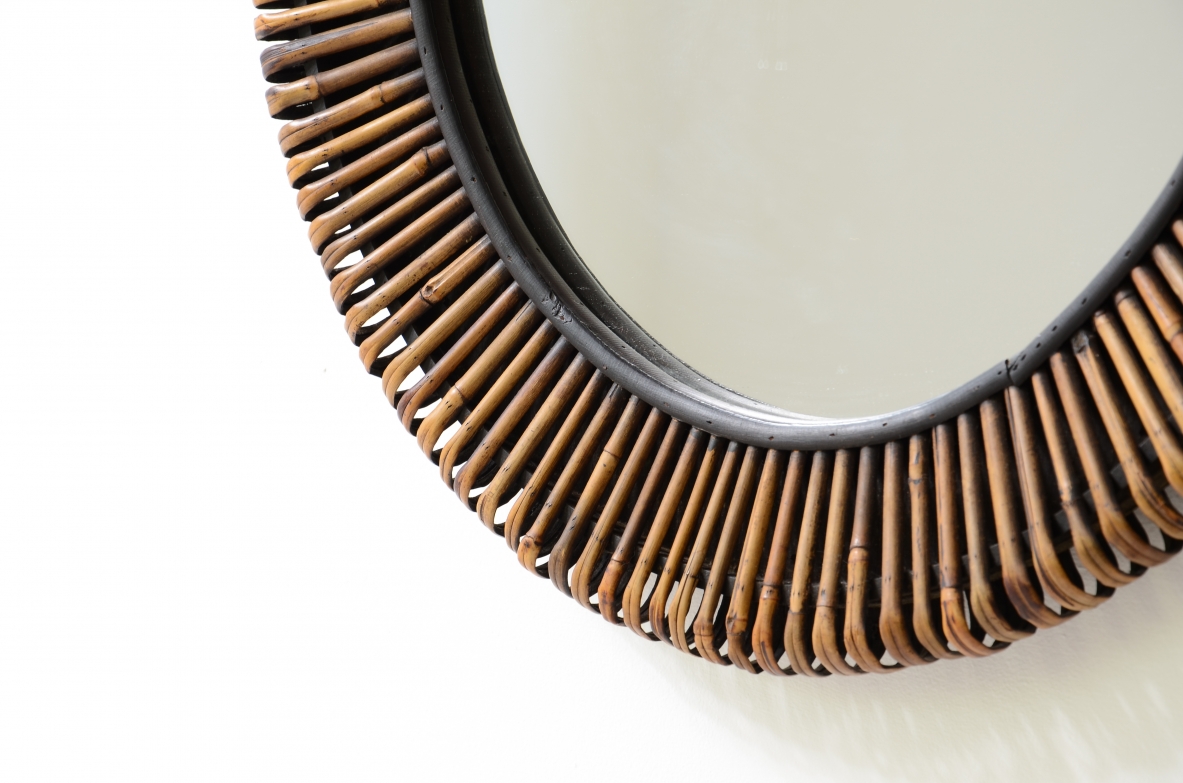 Beautiful mirror with a sunburst cane frame.  Italian manufacture, circa 1950-60.