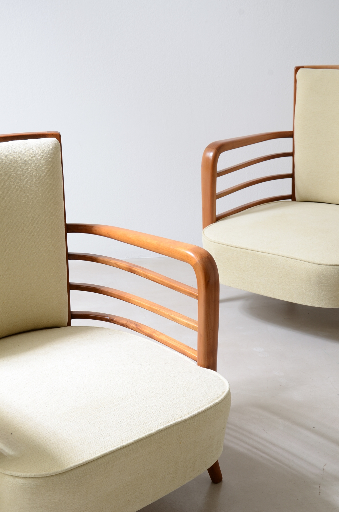 Pair of shaped cherrywood armchairs. Attribution: Paolo Buffa, ca. 1940.