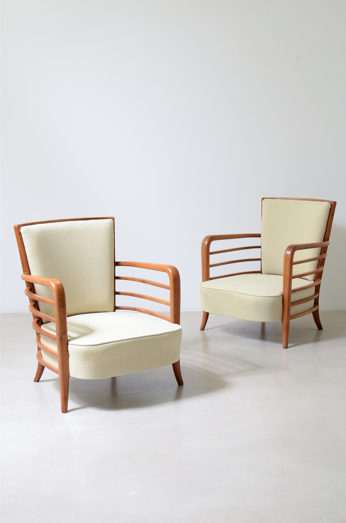 Pair of shaped cherrywood armchairs. Attribution: Paolo Buffa, ca. 1940.