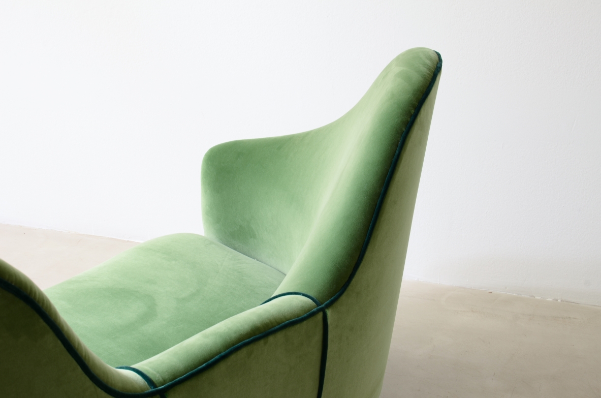 Cesare Lacca  A rare two-seater sofa with enveloping lines, Turned wooden legs.  Italian manufacture, 1950s