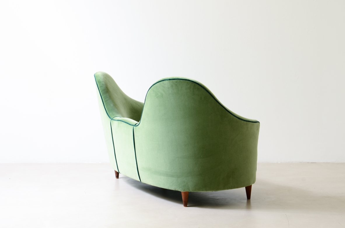 Cesare Lacca  A rare two-seater sofa with enveloping lines, Turned wooden legs.  Italian manufacture, 1950s