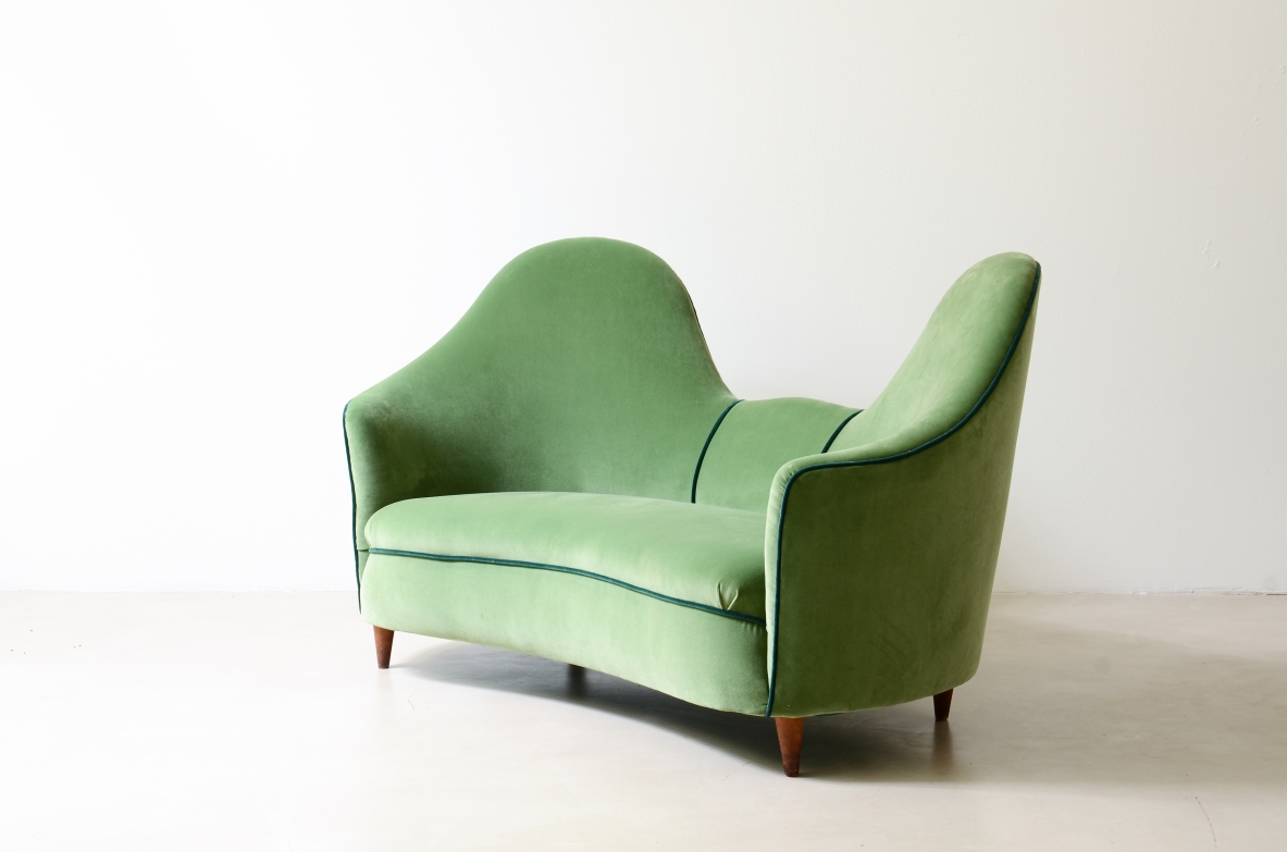 Cesare Lacca  A rare two-seater sofa with enveloping lines, Turned wooden legs.  Italian manufacture, 1950s