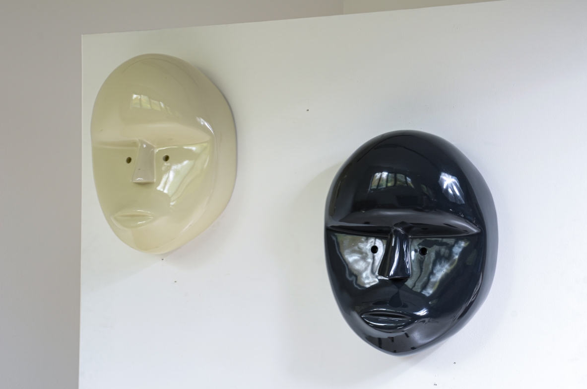 Pair of large lacquered fiberglass masks, Attributed to Joe Colombo; manufactured circa 1970.